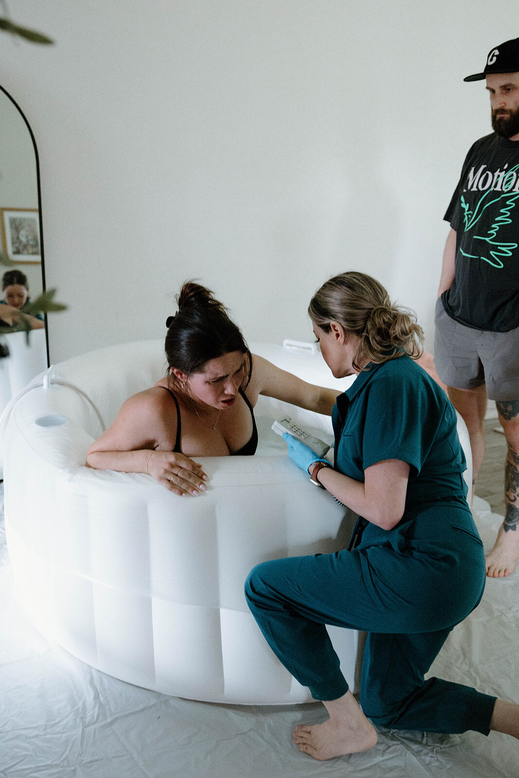 Rhonda checking on a mother during a water birth