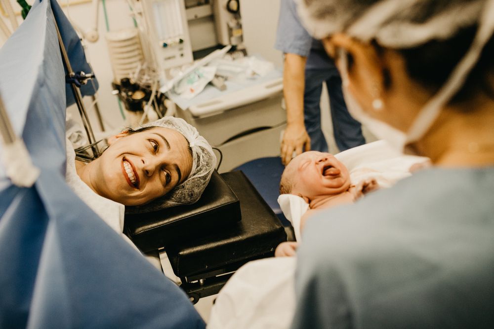 Mother smiling with her newborn